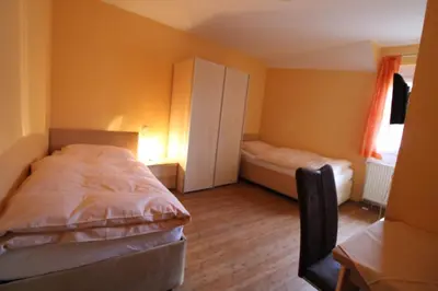Ein Bett oder Betten in einem Zimmer der Unterkunft Gasthaus Deutsches Haus
