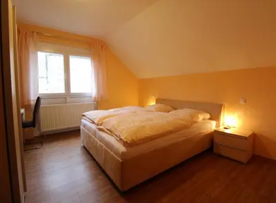 Ein Bett oder Betten in einem Zimmer der Unterkunft Gasthaus Deutsches Haus