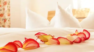Ein Bett oder Betten in einem Zimmer der Unterkunft Hotel Garni am Hechenberg