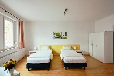 Ein Bett oder Betten in einem Zimmer der Unterkunft Ferienhaus Sommerweide 160qm bis 10P