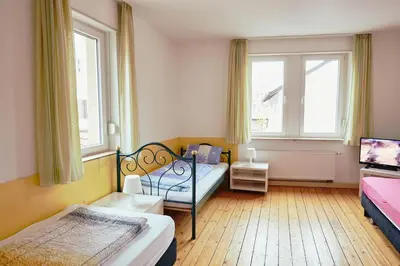 Ein Bett oder Betten in einem Zimmer der Unterkunft Ferienhaus Sommerweide 160qm bis 10P