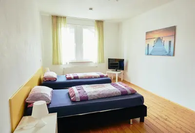 Ein Bett oder Betten in einem Zimmer der Unterkunft Ferienhaus Sommerweide 160qm bis 10P