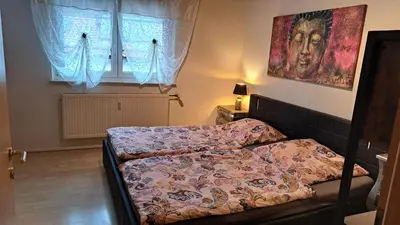 Ein Bett oder Betten in einem Zimmer der Unterkunft Ferienwohnung Jasmin in Schönau bei Heidelberg Fewo 1 mit Terrasse