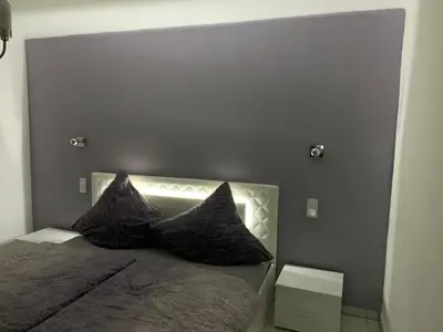 Ein Bett oder Betten in einem Zimmer der Unterkunft Moderne 2 Zimmer Wohnung mit Vollausstattung