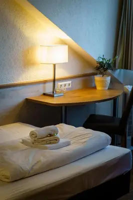 Ein Bett oder Betten in einem Zimmer der Unterkunft Hotel Waibstadter Hof