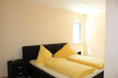Ein Bett oder Betten in einem Zimmer der Unterkunft Ferienwohnung bei Heidelberg