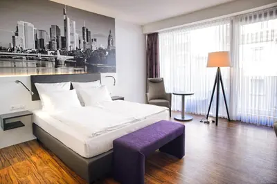 Ein Bett oder Betten in einem Zimmer der Unterkunft Tulip Inn Ludwigshafen City