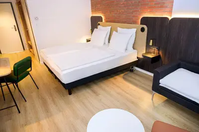 Ein Bett oder Betten in einem Zimmer der Unterkunft Tulip Inn Ludwigshafen City