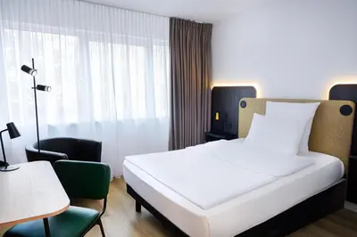 Ein Bett oder Betten in einem Zimmer der Unterkunft Tulip Inn Ludwigshafen City