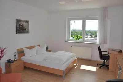Ein Bett oder Betten in einem Zimmer der Unterkunft Hotel Reuterhof
