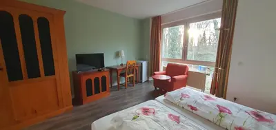 Ein Bett oder Betten in einem Zimmer der Unterkunft Flörsheimer Hof