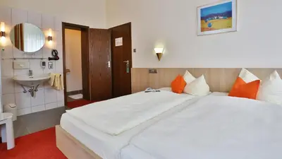 Ein Bett oder Betten in einem Zimmer der Unterkunft City Partner Hotel Berliner Hof