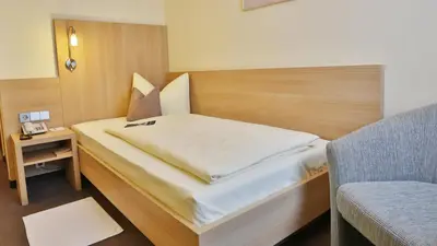 Ein Bett oder Betten in einem Zimmer der Unterkunft City Partner Hotel Berliner Hof
