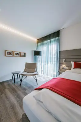 Ein Bett oder Betten in einem Zimmer der Unterkunft Schlosshotel Monrepos