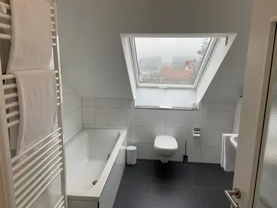 Ein Badezimmer in der Unterkunft BestBoarding24