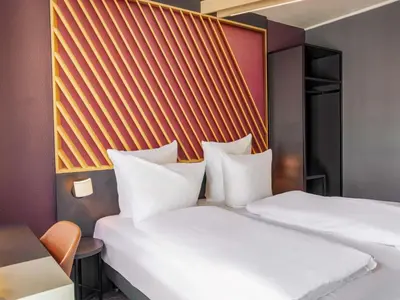 Ein Bett oder Betten in einem Zimmer der Unterkunft B&B HOTEL Mannheim-City