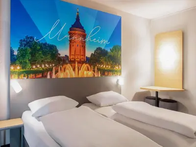 Ein Bett oder Betten in einem Zimmer der Unterkunft B&B HOTEL Mannheim-City