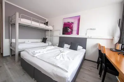 Ein Bett oder Betten in einem Zimmer der Unterkunft hogh Hotel Heilbronn