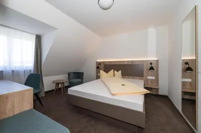 Ein Bett oder Betten in einem Zimmer der Unterkunft Landschloss Korntal
