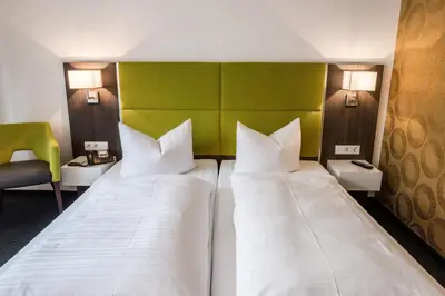 Ein Bett oder Betten in einem Zimmer der Unterkunft Hotel Vorfelder