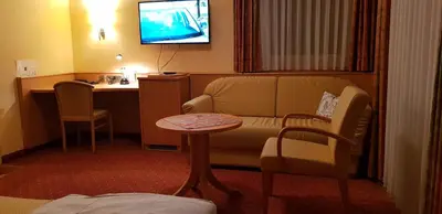 Ein Sitzbereich in der Unterkunft Hotel-Restaurant Fröhlich
