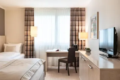 Ein Bett oder Betten in einem Zimmer der Unterkunft Garner Hotel Mainz by IHG