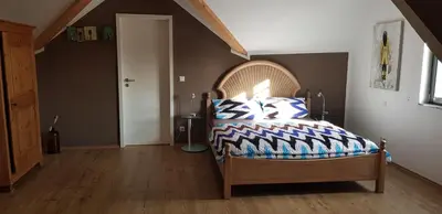 Ein Bett oder Betten in einem Zimmer der Unterkunft Weingut Schunck