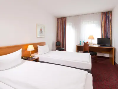 Ein Bett oder Betten in einem Zimmer der Unterkunft ACHAT Hotel Darmstadt Griesheim