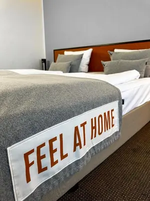 Ein Bett oder Betten in einem Zimmer der Unterkunft Coffee Fellows Hotel Frankfurt Airport-Langen