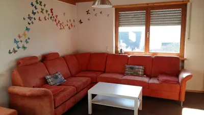 Ein Sitzbereich in der Unterkunft Ferienwohnung Auf Schäfers Spuren