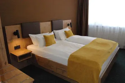 Ein Bett oder Betten in einem Zimmer der Unterkunft Hotel Am Markt