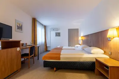 Ein Bett oder Betten in einem Zimmer der Unterkunft Trip Inn Kongresshotel Frankfurt-Rodgau