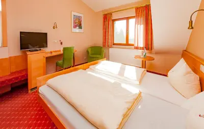 Ein Bett oder Betten in einem Zimmer der Unterkunft Hotel Bett & Frühstück