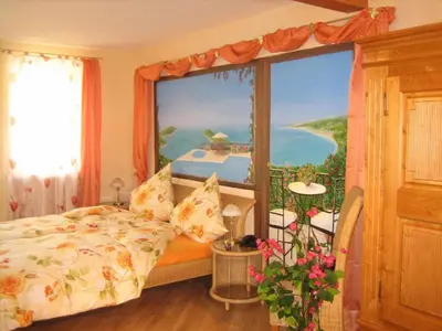 Ein Bett oder Betten in einem Zimmer der Unterkunft Cleo´s Hotel Kallstadt