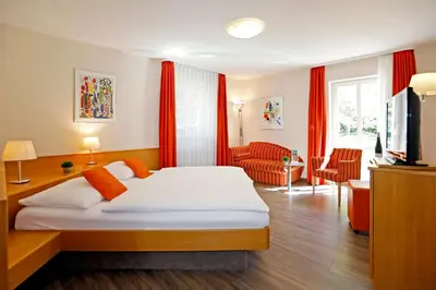 Ein Bett oder Betten in einem Zimmer der Unterkunft Landhotel Altes Wasserwerk GbR