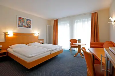 Ein Bett oder Betten in einem Zimmer der Unterkunft Landhotel Altes Wasserwerk GbR