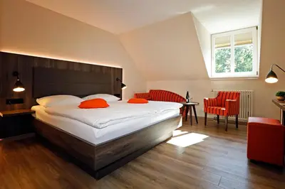 Ein Bett oder Betten in einem Zimmer der Unterkunft Landhotel Altes Wasserwerk GbR