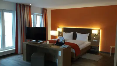 Ein Bett oder Betten in einem Zimmer der Unterkunft Hotel-Restaurant Pfälzer Hof