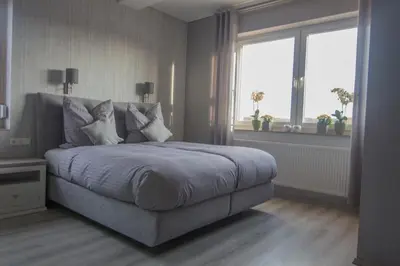 Ein Bett oder Betten in einem Zimmer der Unterkunft Villa Kopp-Das Gästehaus