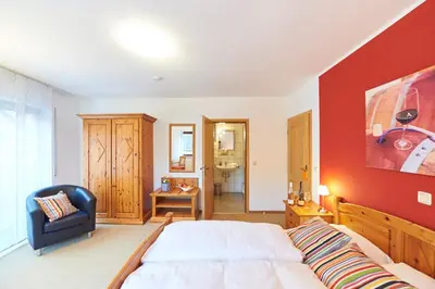 Ein Bett oder Betten in einem Zimmer der Unterkunft Gästehaus Achenbach