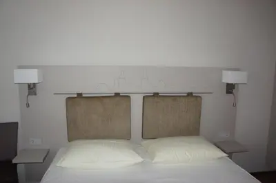 Ein Bett oder Betten in einem Zimmer der Unterkunft Stadthotel Engel