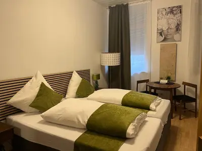 Ein Bett oder Betten in einem Zimmer der Unterkunft Pension Stadt Mannheim