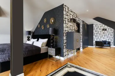Ein Bett oder Betten in einem Zimmer der Unterkunft Parkhotel Luise Bad Herrenalb