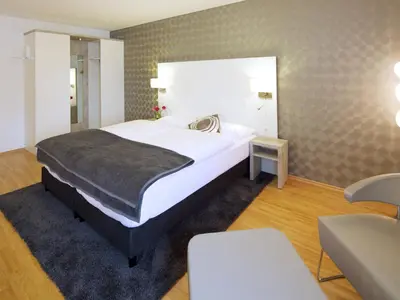 Ein Bett oder Betten in einem Zimmer der Unterkunft Hotel Karolinger Hof