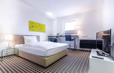 Ein Bett oder Betten in einem Zimmer der Unterkunft Designhotel Youngstar