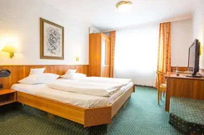 Ein Bett oder Betten in einem Zimmer der Unterkunft AAAA Hotelwelt KÜBLER