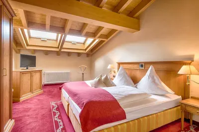 Ein Bett oder Betten in einem Zimmer der Unterkunft Ringhotel Mönch`s Waldhotel