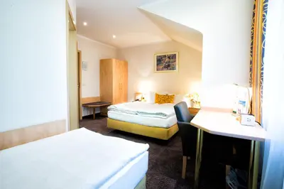 Ein Bett oder Betten in einem Zimmer der Unterkunft Hotel & Living Am Wartturm