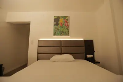 Ein Bett oder Betten in einem Zimmer der Unterkunft Galeria Airport Hotel