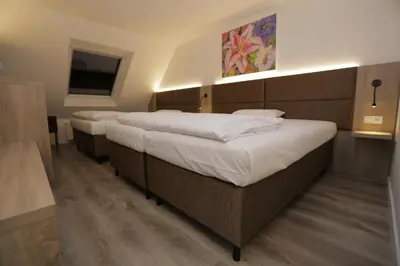 Ein Bett oder Betten in einem Zimmer der Unterkunft Galeria Airport Hotel